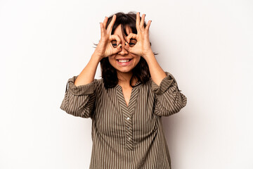 Young hispanic woman isolated on white background excited keeping ok gesture on eye.