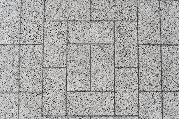 Close up, texture, background. Rectangular paving slabs from a granite crumb.