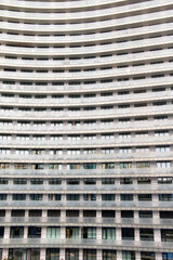 Many glass windows of a multi-storey building, housing stock.