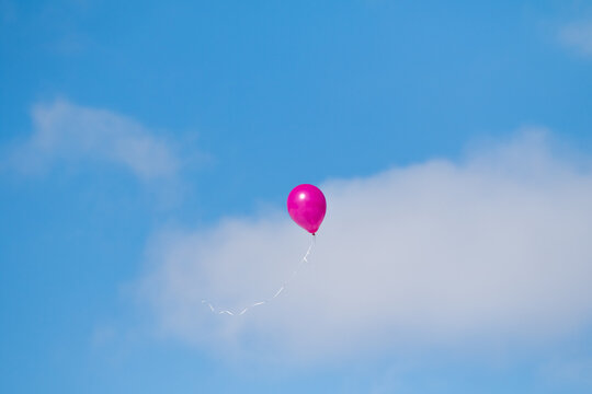 rubber balloon high in the blue sky