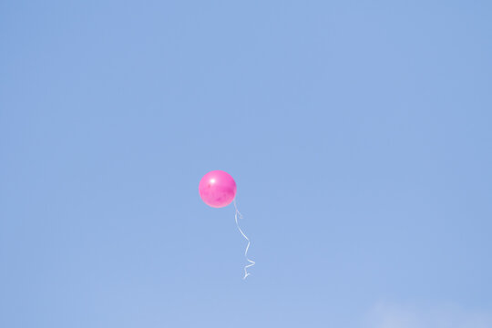rubber balloon high in the blue sky