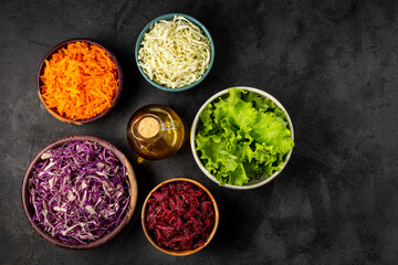 Fresh grated vegetables in bowls on the table. Healthy food.