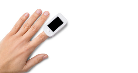 Top view of pulse oximeter on finger to measuring saturation oxygen level and pulse rate isolated...