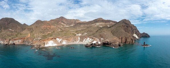 aerial panorama view of the wild and rugged coastline of the Cabo de Gata Nature Reserve in...