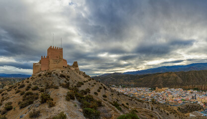 Fototapeta na wymiar view of the Moorish castle and village of Tabernas in the desert of Andalusia