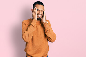 Young african american man wearing casual clothes with hand on head, headache because stress. suffering migraine.