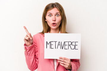 Young English business woman holding a metaverse placard isolated on white background having some great idea, concept of creativity.