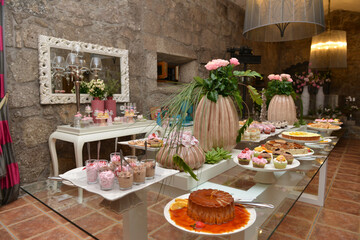 Santo Tirso, Portugal, June 20, 2015: Delicious sweets and bakery at the wedding celebration. Wedding dessert buffet station.