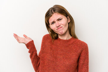 Young russian woman isolated on white background doubting and shrugging shoulders in questioning...