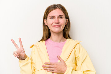 Young English woman isolated on white background taking an oath, putting hand on chest.