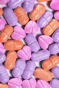 Closeup shot of a pile of bright colorful vitamin pills.