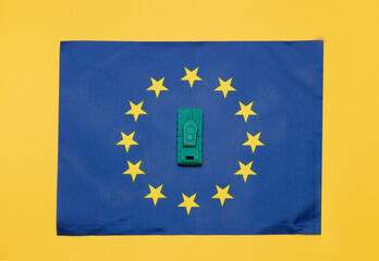 Ivanovo, Russia - 03.03.2022: miniature of real tank on flag of  European Union: no war, danger of military action, commonwealth and alliance in overcoming the humanitarian barriers of aggression