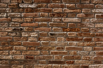 Old brick wall background texture broken bricks cement joints brown red