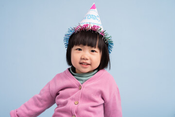 lovely baby girl portrait, isolated on blue background