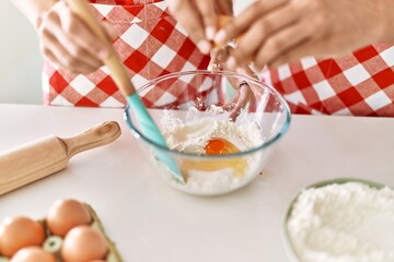 Cook hands mixing ingredients to make dough for homemade bread at kitchen.