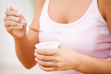 Pink: Anonymous Woman Eating Healthy Yogurt