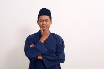 Young Asian man standing confidently close his eyes, isolated on white background