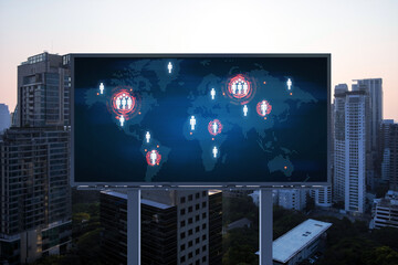 Glowing hologram of Earth planet map on billboard over aerial panoramic cityscape of Bangkok at sunset. The concept of international business in Southeast Asia.