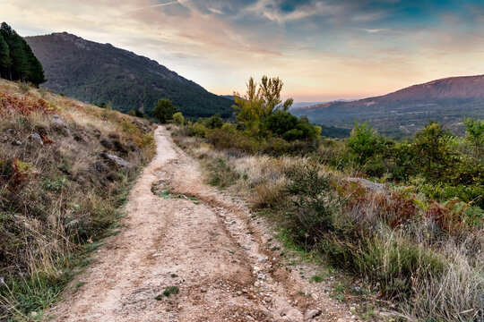 Road and sunrise by Arcon Cliff in Sierra de Guadarrama. Madrid. Spain. Europe.