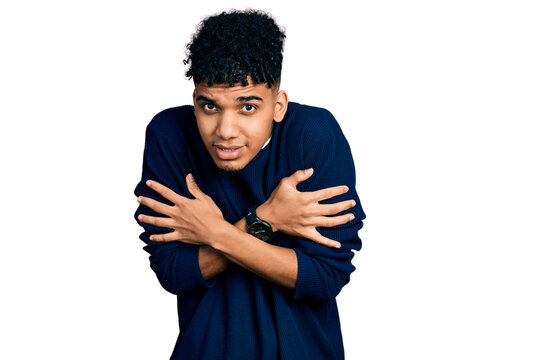 Young african american man wearing casual clothes shaking and freezing for winter cold with sad and shock expression on face
