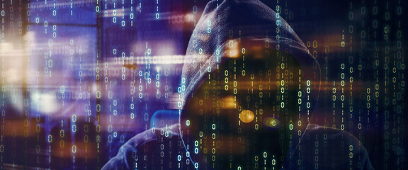 Double exposure of hooded hacker with binary code