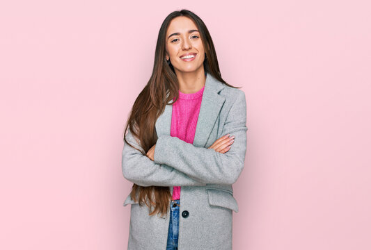 Young hispanic girl wearing business clothes happy face smiling with crossed arms looking at the camera. positive person.