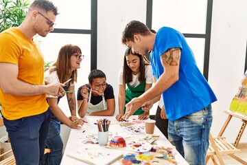 Group of people drawing at art studio.