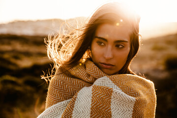 Beautiful woman wrapped in a wool towel