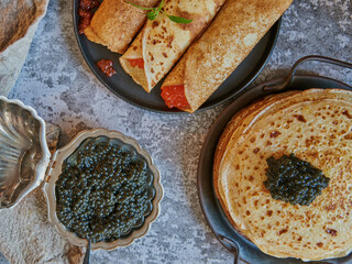 Pancake week. Pancakes with red and black caviar.