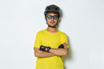 portrait young handsome man wearing cyclist helmet isolated on white background

