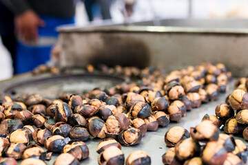 Close up of Roasted Chestnuts. Outstanding street food in Turkey and  favorite snack for Turkish it hot chestnuts roasted on a grill with their skin on