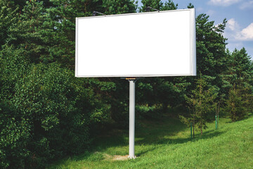 Blank billboard mockup with white screen. Against the backdrop of nature and blue sky. Business concept. Copy space banner for advertising.