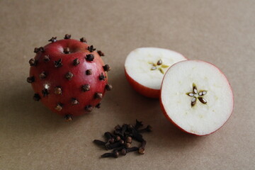 Carnations on Apple, Traditional apple and clove, Selective focus.