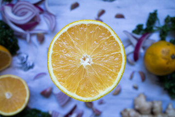 Obraz na płótnie Canvas fresh orange cut in half gastronomy environment