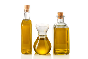 Bottles and decanter of extra virgin olive oil isolated on white, clipping path