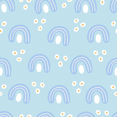 Kids seamless pattern with rainbows on light blue background