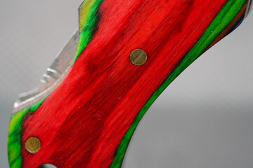 Damask hand-forged knife made of several layers of steel with an exclusive pattern photographed in...
