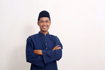 Smile happy face of ordinary Asian man in muslim costume. Concept of charming and positive thinking
