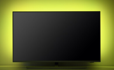 Close-up of a large LED TV with backlight.TV set in a cozy living room.  
