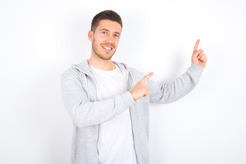young caucasian man wearing casual clothes over white background with positive expression,...