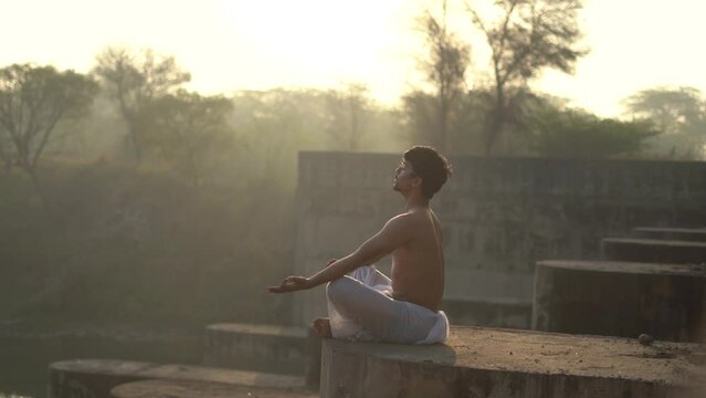 young boy working out and doing yoga early in the morning.Healthy lifestyle conept.
