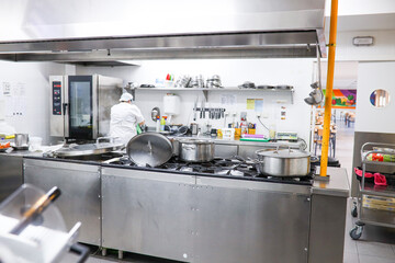 school kitchen in the middle of preparing the menu for the students who eat in the school dining...