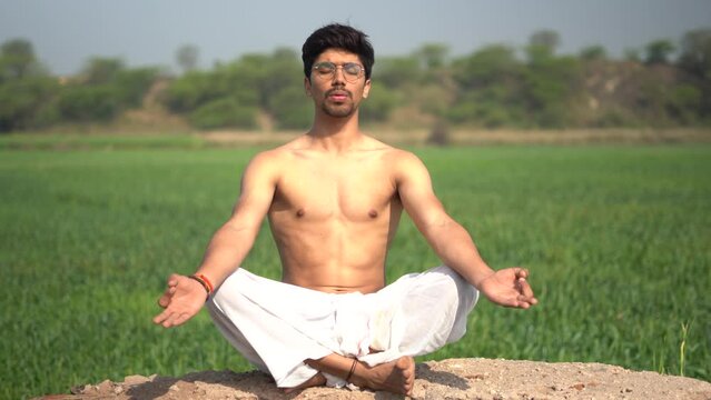 young boy working out and doing yoga early in the morning.Healthy lifestyle conept.