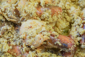 Spicy Indian prawn food dish, prepared with coconut for nice taste. close up image of the prawns being served.