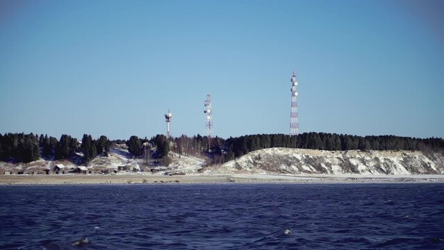 The seashore by which the ship sails. CLIP. View from the ship to the rocky shore where the cell towers are located