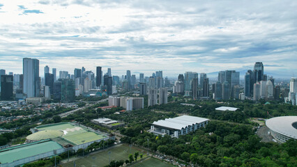 Naklejka na ściany i meble Aerial view of the Beautiful scenery of Senayan Stadium. with Jakarta cityscape background. Jakarta, Indonesia, March 8, 2022