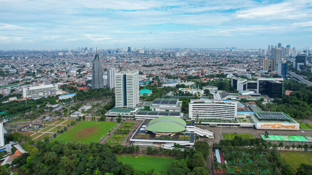 Aerial view of the Indonesia Parliament Complex, which is also known as the DPR or MPR building with Jakarta cityscape. Jakarta, Indonesia, March 8, 2022