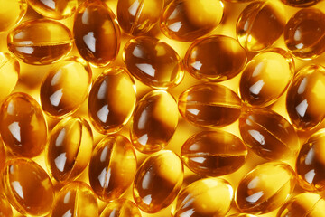 Golden Vitamin D3 Capsules close-up in full screen
