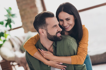 Portrait of attractive amorous sweet cheerful couple hugging spending time weekend day pastime at home house flat indoors - obrazy, fototapety, plakaty