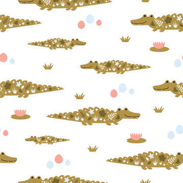 Cute crocodiles in seamless vector pattern for kids textile or wrapping paper. Funny childish wallpaper with repeating texture ornament